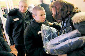 300 Boys in the prison camp in the Volgograd region of South Russia recieve gifts of warm clothing, personal hygiene kits and food.